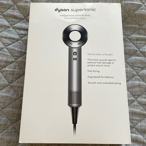 White dyson supersonic hairdryer.